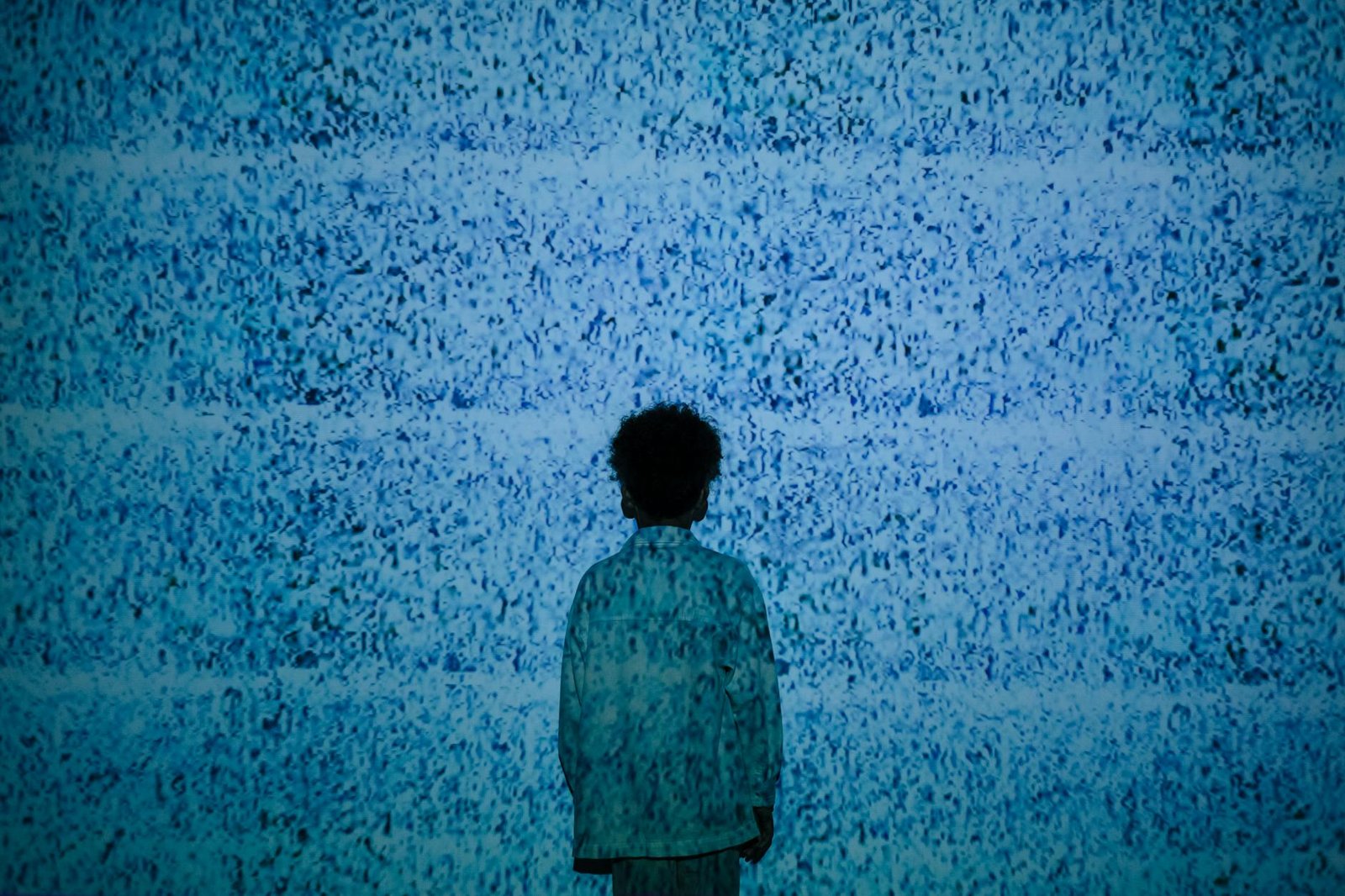 boy standing in noise